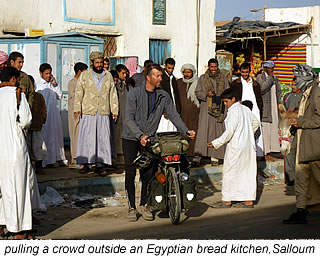 pulling a crowd outside bread kitchen Salloum, Egypt